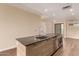 Modern kitchen features stainless steel appliances, light wood cabinets and a spacious center island with stone countertops at 2300 E Campbell Ave # 114, Phoenix, AZ 85016