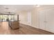 Bright kitchen with island, stainless steel appliances, and bar seating, seamlessly connected to an outdoor patio with a view at 2300 E Campbell Ave # 114, Phoenix, AZ 85016