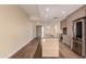 Modern kitchen features stainless steel appliances, light wood cabinets and a spacious center island with stone countertops at 2300 E Campbell Ave # 114, Phoenix, AZ 85016