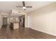 Open living room with stainless steel appliances and a large island, seamlessly flowing to a well-lit living area at 2300 E Campbell Ave # 114, Phoenix, AZ 85016