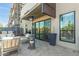 Relaxing patio seating with heater and modern sliding glass doors at 2300 E Campbell Ave # 114, Phoenix, AZ 85016