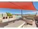 Beautiful rooftop deck with comfortable seating, dining area, and stunning city views at 2300 E Campbell Ave # 114, Phoenix, AZ 85016