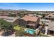 Beautiful home with a well-kept lawn, a swimming pool, and an abundance of desert landscaping at 23081 S 223Rd Way, Queen Creek, AZ 85142