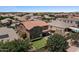 Aerial view of home showcasing spacious lawn, mature trees, desert landscaping, and refreshing swimming pool at 23081 S 223Rd Way, Queen Creek, AZ 85142
