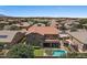 Beautiful aerial view of the home featuring a private pool, well-manicured lawn, and desert landscaping at 23081 S 223Rd Way, Queen Creek, AZ 85142