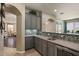 Beautiful bar area with granite countertops, mosaic tile and custom cabinetry at 23081 S 223Rd Way, Queen Creek, AZ 85142