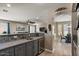 Granite countertop with tile backsplash, stainless steel sink and mini fridge at 23081 S 223Rd Way, Queen Creek, AZ 85142