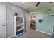 Bedroom featuring neutral paint, built-in shelving, and an open doorway to another room at 23081 S 223Rd Way, Queen Creek, AZ 85142