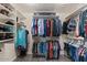 Walk-in closet features custom shelving and ample storage space at 23081 S 223Rd Way, Queen Creek, AZ 85142