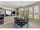 Dining area with backyard views, tile flooring and modern table at 23081 S 223Rd Way, Queen Creek, AZ 85142