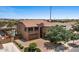 Two-story home with a brick driveway, three-car garage, and desert landscaping at 23081 S 223Rd Way, Queen Creek, AZ 85142