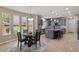 Eat-in kitchen featuring stainless appliances, large center island and sleek cabinetry at 23081 S 223Rd Way, Queen Creek, AZ 85142