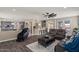 Spacious open concept living room with modern furniture and lots of natural light at 23081 S 223Rd Way, Queen Creek, AZ 85142