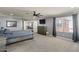 Spacious main bedroom featuring carpet floors, gray walls, and a ceiling fan at 23081 S 223Rd Way, Queen Creek, AZ 85142