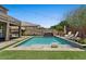 Backyard pool featuring a baja shelf, spa, and artificial turf at 23081 S 223Rd Way, Queen Creek, AZ 85142