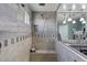 Shower area showcases stylish gray tile, a built-in bench, and a convenient niche for toiletries at 23081 S 223Rd Way, Queen Creek, AZ 85142