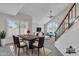 Open-concept living space with vaulted ceilings, lots of light and a view to the stairs at 2340 W Myrtle Dr, Chandler, AZ 85248