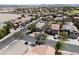 This aerial shot highlights a vibrant residential area with lush landscaping and beautiful houses with mountain scenery at 23645 W Parkway Dr, Buckeye, AZ 85326