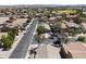 This aerial captures a charming neighborhood featuring tidy homes and manicured lawns with views of distant mountains at 23645 W Parkway Dr, Buckeye, AZ 85326