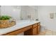 Bathroom featuring wood vanity with white countertop and decorative basket at 23645 W Parkway Dr, Buckeye, AZ 85326