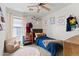 Bright bedroom with whimsical decor, playful accessories, and a cozy reading nook at 23645 W Parkway Dr, Buckeye, AZ 85326