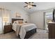 Cozy bedroom featuring a neutral color palette, comfortable carpet, and soft, natural light at 23645 W Parkway Dr, Buckeye, AZ 85326