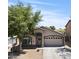 Charming single-story home with a well-maintained front yard and a two-car garage on a sunny day at 23645 W Parkway Dr, Buckeye, AZ 85326