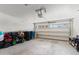 Spacious two-car garage with overhead door, perfect for parking and storage at 23645 W Parkway Dr, Buckeye, AZ 85326