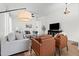 Spacious living room with stylish decor, cozy seating, and modern lighting at 23645 W Parkway Dr, Buckeye, AZ 85326