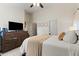 Spacious primary bedroom with dark wood furniture and a plush king-size bed at 23645 W Parkway Dr, Buckeye, AZ 85326