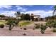 Scenic view of the park highlighting green space, playground, walking paths and picnic shelter at 23645 W Parkway Dr, Buckeye, AZ 85326