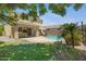 Private backyard with pool, patio, and mature trees, ideal for relaxing and enjoying the outdoors at 23733 S 209Th Pl, Queen Creek, AZ 85142