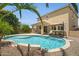 Serene backyard oasis featuring a refreshing pool, covered patio, and low maintenance landscaping at 23733 S 209Th Pl, Queen Creek, AZ 85142