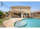 Inviting backyard with sparkling pool, covered patio, and lush landscaping perfect for outdoor entertaining at 23733 S 209Th Pl, Queen Creek, AZ 85142