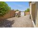 Backyard featuring a playhouse and garden shed on a sunny day at 23733 S 209Th Pl, Queen Creek, AZ 85142