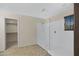 Bright bathroom featuring a glass-enclosed shower, tiled floors, and a walk-in closet at 23733 S 209Th Pl, Queen Creek, AZ 85142
