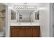 Elegant bathroom with double sinks, updated fixtures, wood cabinets and a shower at 23733 S 209Th Pl, Queen Creek, AZ 85142