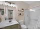 Bathroom featuring a framed mirror, a glass-enclosed shower, a decorative shelves and modern finishes at 23733 S 209Th Pl, Queen Creek, AZ 85142