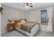 Comfortable bedroom with neutral tones, soft bedding, and window, creating a calming retreat at 23733 S 209Th Pl, Queen Creek, AZ 85142