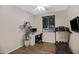 Bedroom featuring hard surface floors, a modern ceiling fan, a window with blinds, and workout equipment at 23733 S 209Th Pl, Queen Creek, AZ 85142