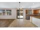 Open concept living space featuring tile floors, a sliding glass door, and a kitchen with stainless steel appliances at 23733 S 209Th Pl, Queen Creek, AZ 85142