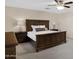 Cozy main bedroom featuring ceiling fan, neutral colors, carpet, windows, and wood furniture at 23733 S 209Th Pl, Queen Creek, AZ 85142