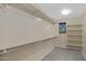 Spacious walk-in closet with built-in shelving and ample storage space, perfect for organization at 23733 S 209Th Pl, Queen Creek, AZ 85142
