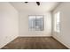 A well-lit room with a ceiling fan and windows, complete with neutral-toned walls and carpets at 2402 E 5Th St # 1411, Tempe, AZ 85288