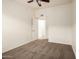 Carpeted bedroom featuring a ceiling fan, neutral walls, and a connecting doorway at 2402 E 5Th St # 1411, Tempe, AZ 85288