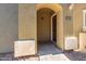 Inviting front entryway with stone facade and covered porch leading to the home's entrance with the address number above the door at 2402 E 5Th St # 1411, Tempe, AZ 85288
