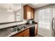 Well-equipped kitchen boasts stainless steel appliances and stylish countertops for a modern and efficient cooking space at 2402 E 5Th St # 1411, Tempe, AZ 85288