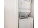 A stacked washer and dryer setup neatly placed for convenient laundry access at 2402 E 5Th St # 1411, Tempe, AZ 85288