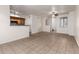 Open-concept living room showcases tile floors, a ceiling fan, and a breakfast bar for versatile living and entertaining at 2402 E 5Th St # 1411, Tempe, AZ 85288