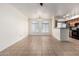 Open living area features tile flooring, modern lighting, and flows seamlessly into the kitchen, perfect for entertaining guests at 2402 E 5Th St # 1411, Tempe, AZ 85288